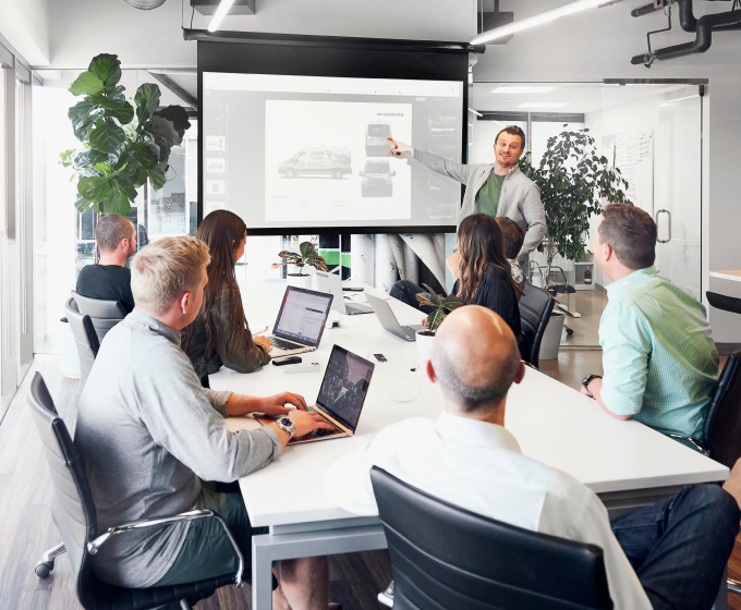 Team photo, attending a meeting in a conference room.