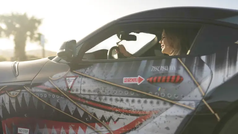 A lady driving a wrapped car mobile