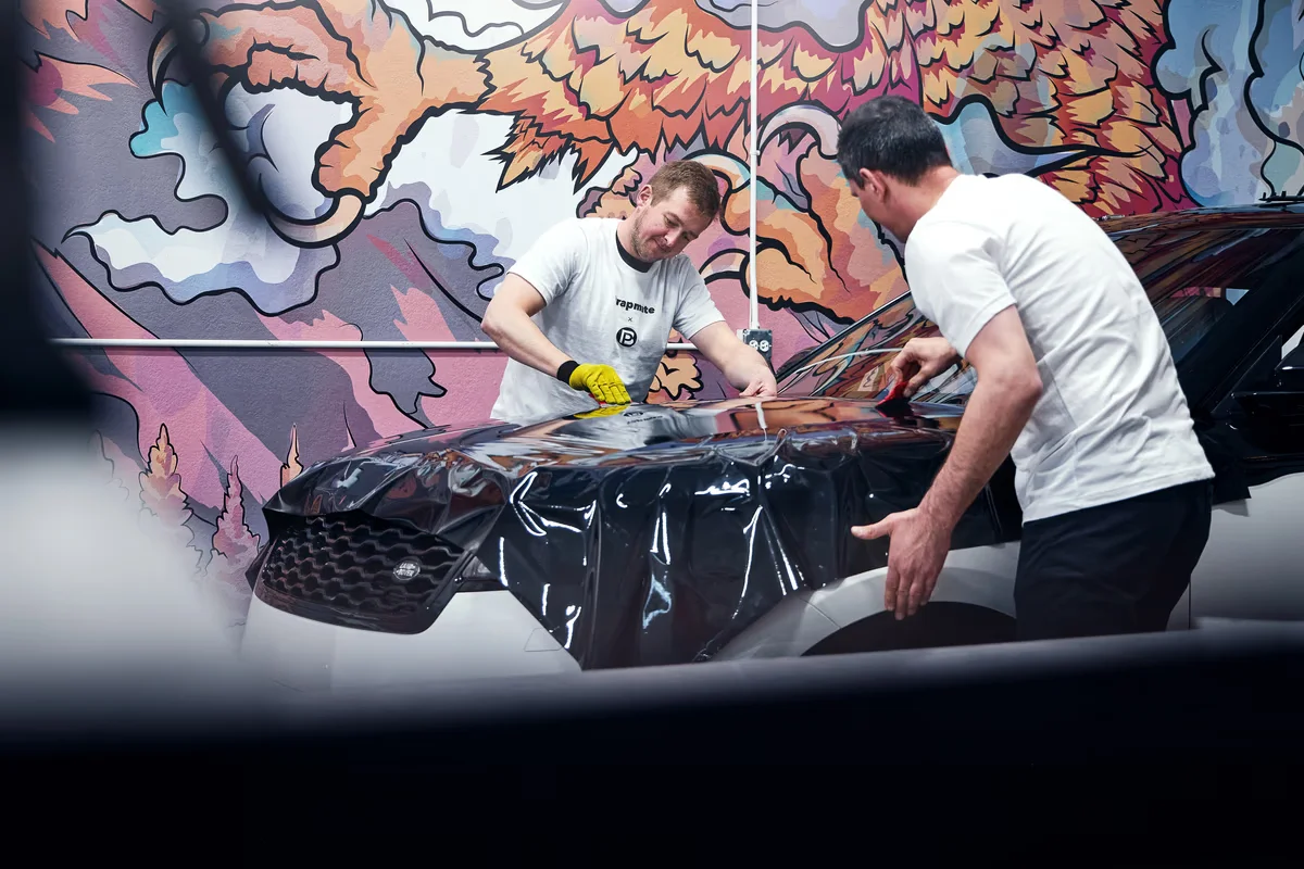 Professional wrap installation protecting vehicle paint