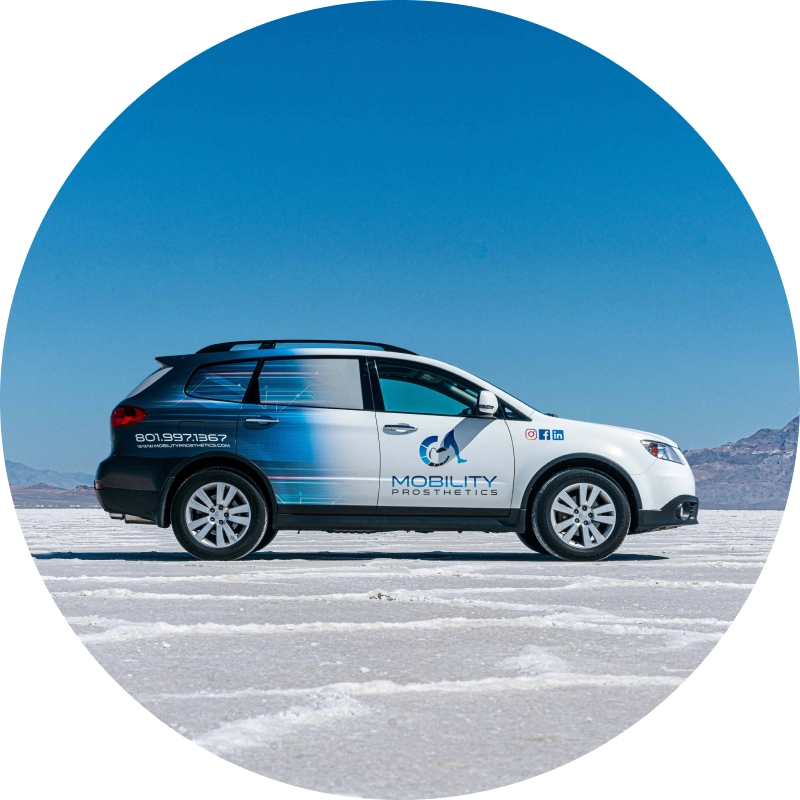 Small SUV wrapped in a gradient color in Utah desert